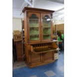 A Victorian Golden Oak Secretaire Bookcase. The Base with Fitted Drawer and Tooled Leather Writing