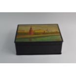 A Russian Lacquered Papier Mache Work Box. The Hinged Lid Decorated with View of The Grand Kremlin