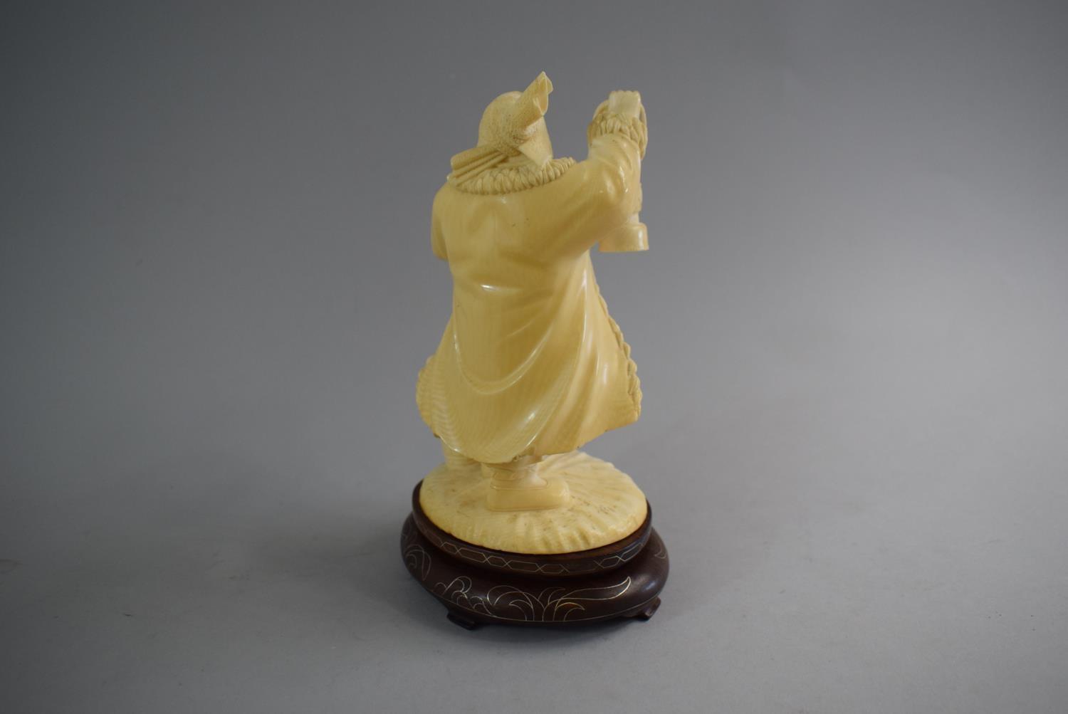 A Carved Chinese Ivory Figure in the Form of Standing Farmer Holding Lantern and Basket. Set on - Image 2 of 3
