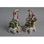 A Pair of 19th Century Continental Figural Ornaments of Seated Lady and Gent on Scrolled Raised