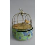 A Mid 20th Century Tin Plate Musical Bird on Swing Automaton with Pull Out Drawer, 16cm Diameter