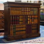 A Late 20th Century Oak Television or Radiator Cover in the Form of Bookcase containing Leather