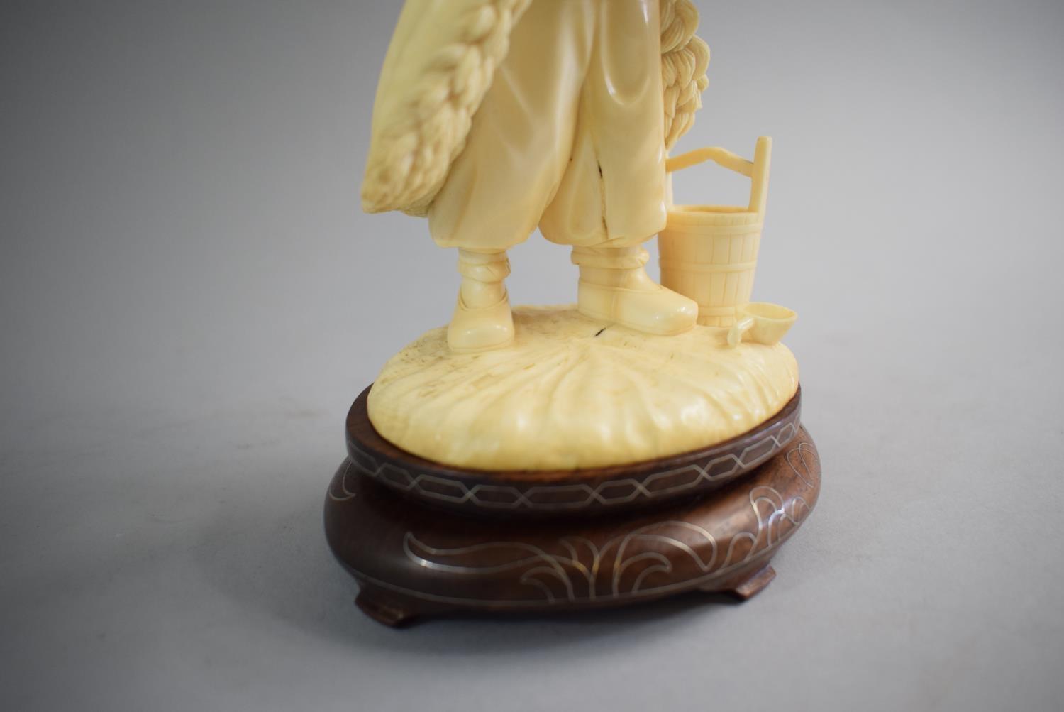 A Carved Chinese Ivory Figure in the Form of Standing Farmer Holding Lantern and Basket. Set on - Image 3 of 3
