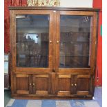 A Modern Stained Oak Glazed Shop Display Cabinet with Cupboards to Base, Three Glass Shelves.