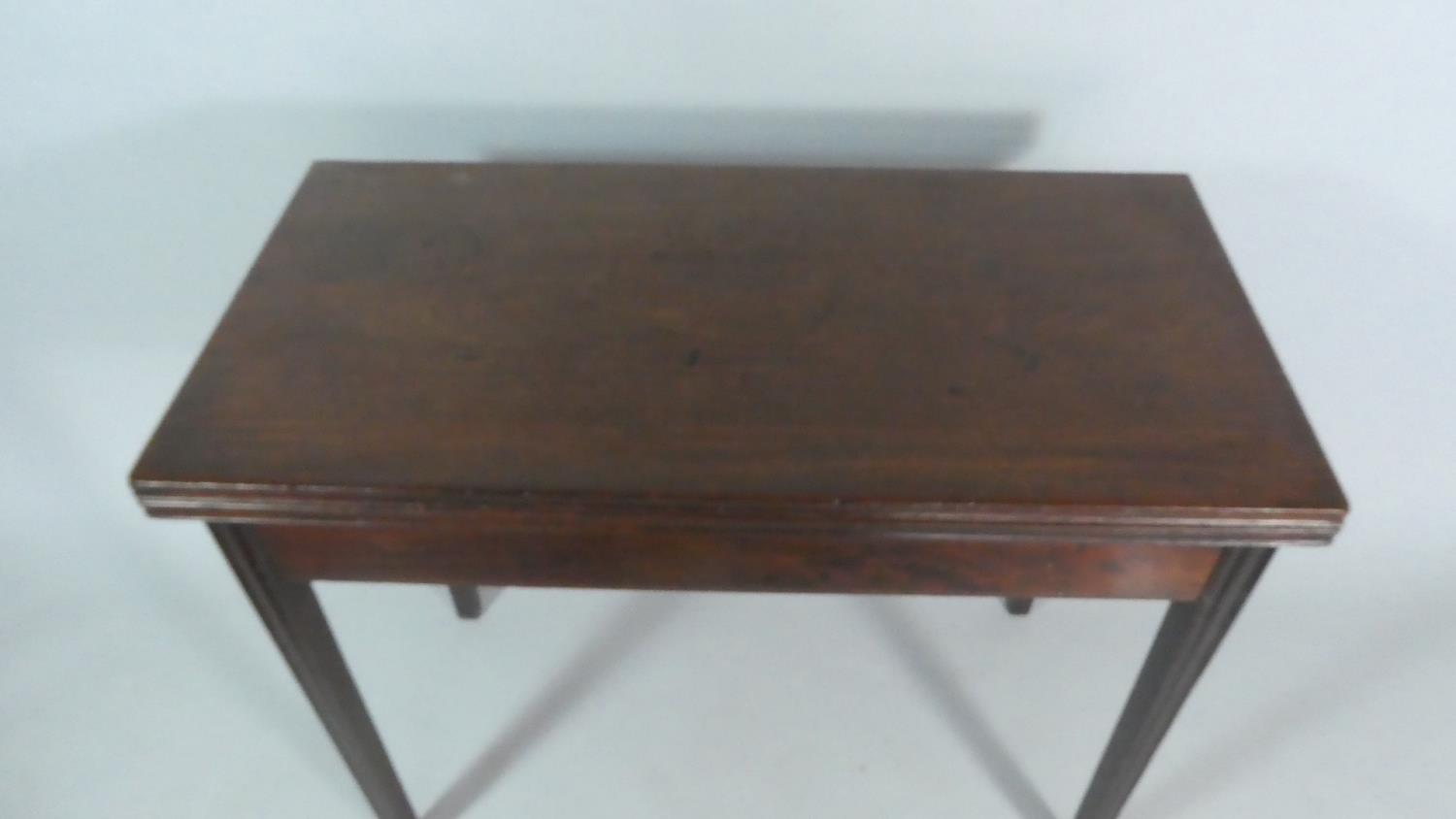 A 19th Century Lift Top Tea Table on Tapering Reeded Supports. 92cm Wide - Image 2 of 3