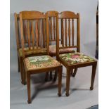 A Set of Four Light Oak Tapestry Seated Dining Chairs