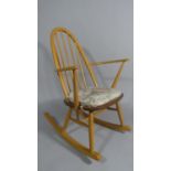 A Vintage Ercol Golden Dawn Beech and Elm Quaker Rocking Chair with Hooped Spindle Back