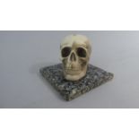 An Interesting Paperweight Moulded As a Human Skull on a Marble Plinth, 10cm x 10cm x 7cm