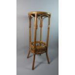 A Circular Bamboo Jardiniere Stand with Stretcher Shelf, 75cm High