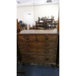 A 19th Century Crossbanded Chest of Two Short and Three Long Drawers with Turned Wooden Handles