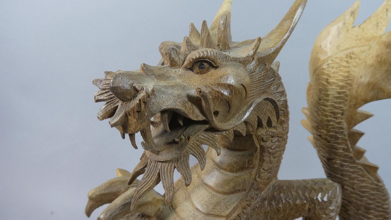 A Large Modern Carved Wooden Study of a Dragon, 41.5cm High - Image 2 of 2