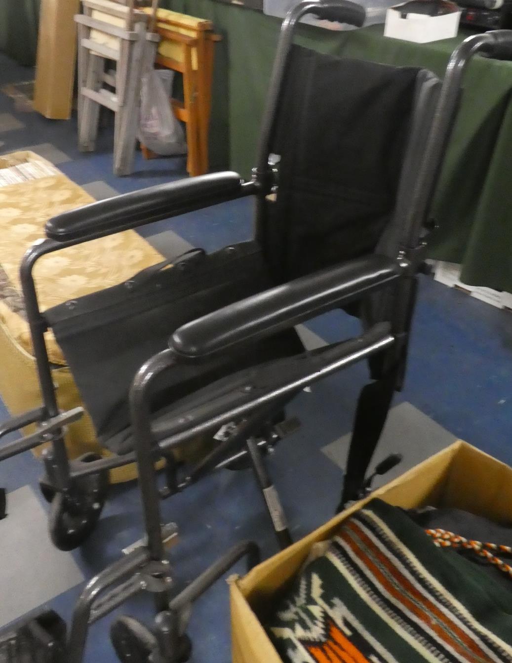 A Folding Wheelchair