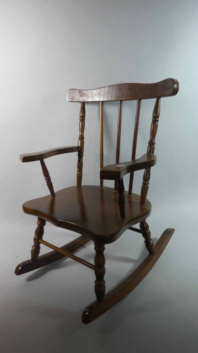 A Mid/Late 20th Century Child's Spindle Back Rocking Chair