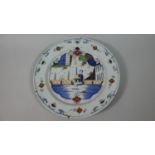 A Delft Polychrome Charger, C.1750 Painted in Blue, Iron Red, Yellow, Purple and Green. Decorated