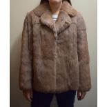A Ladies "Taube Collection" Faux Fur Coat
