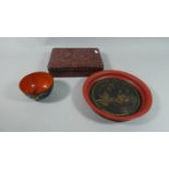 A Lacquered Oriental Papier Mache Rectangular Box Together with a Circular Tray and Bowl