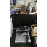 A Small Flat Screen 18" TV Together with DVD Player and Digital Box