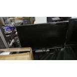 A Sharp 21" Flat Screen TV with Remote