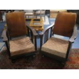 A Pair of Edwardian Oak Framed Reclining Armchairs