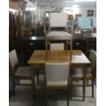 A Gordon Russell Vintage Extending Dining Table and Five Chairs Including One Carver