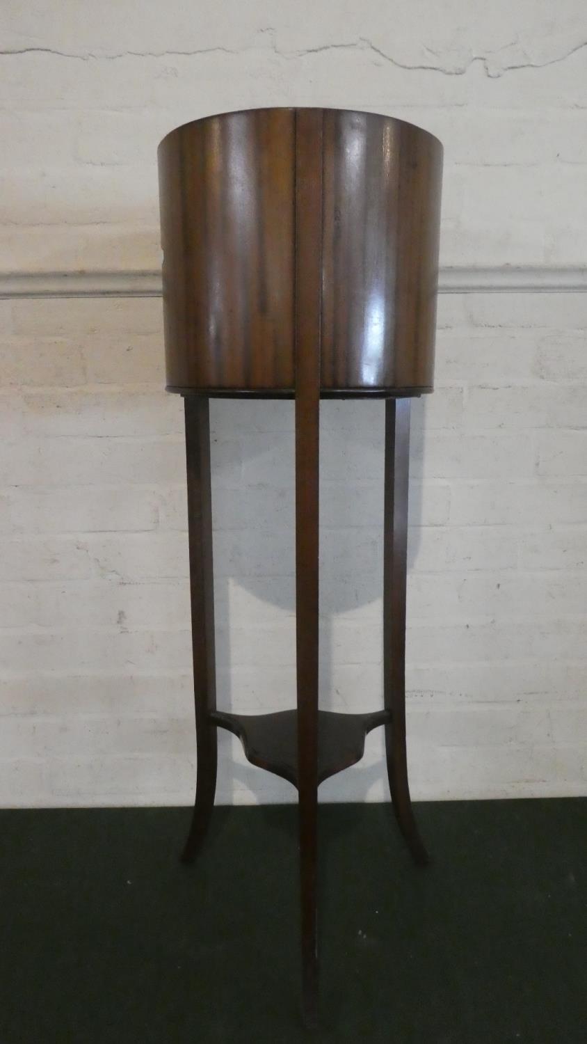 An Edwardian Cylindrical Mahogany Plant Stand on Tripod Support with Stretcher Shelf, Original Metal