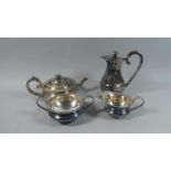 A Silver Plated Three Piece Teaservice and an Unrelated Hot Water Jug