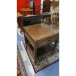 An Oak Square Top Trolley with Stretcher Shelf and Drawer Together with a Stained Pine Three Shelf