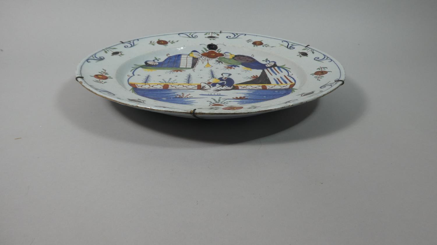 A Delft Polychrome Charger, C.1750 Painted in Blue, Iron Red, Yellow, Purple and Green. Decorated - Image 2 of 3