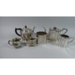 A Silver Plated Three Piece Teaservice Together with Teapot, Cream and Sugar on Galleried Tray