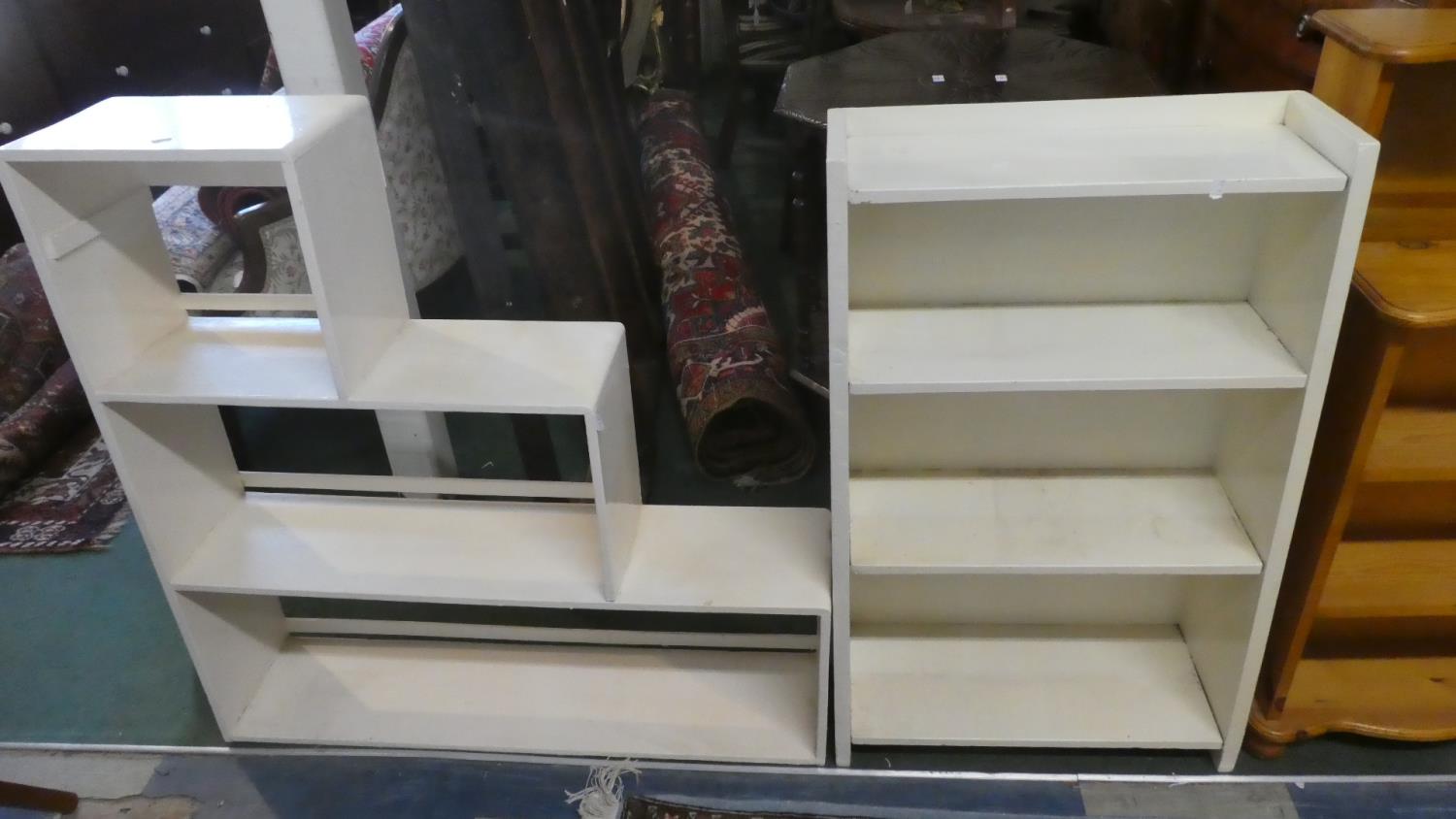 A White Painted Waterfall Bookcase and a Stepped Example