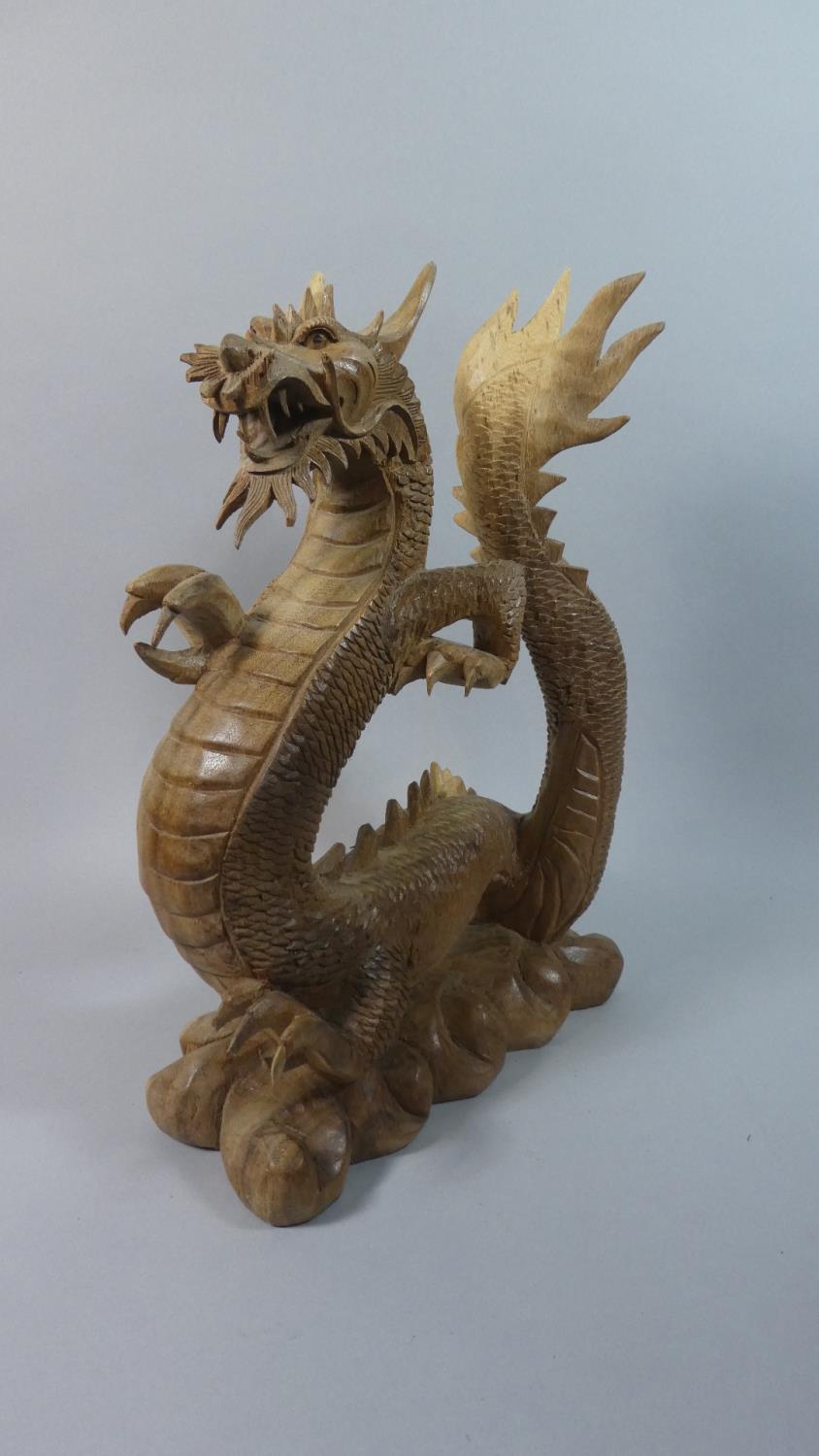 A Large Modern Carved Wooden Study of a Dragon, 41.5cm High