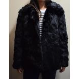 A Ladies Faux Fur Coat