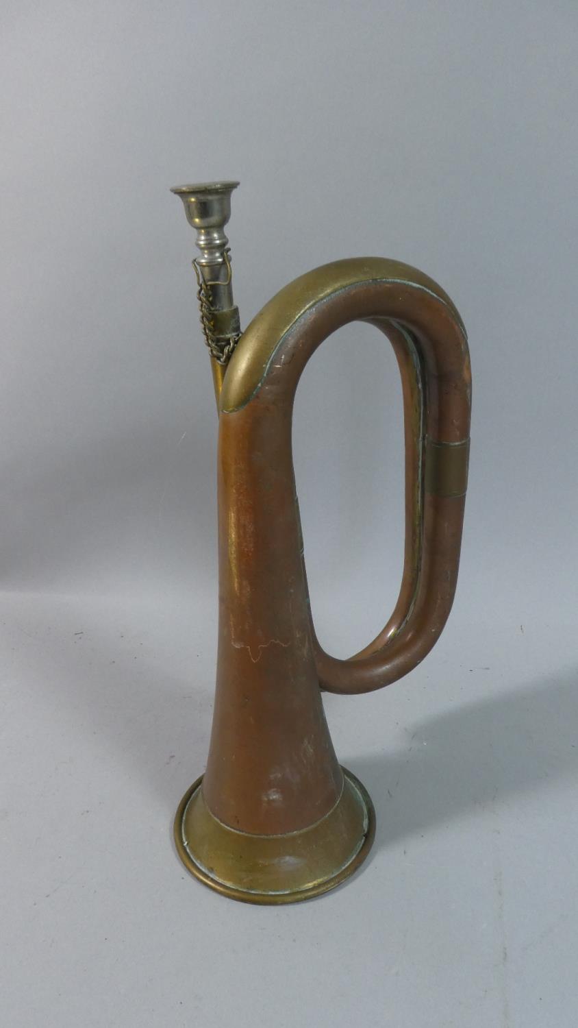 A Military Copper and Brass Bugle, 30cm high