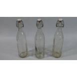 A Collection of Three Vintage Corona Glass Lemonade Bottles, Each 32cm high