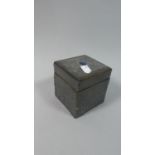 A Tin Mounted Wooden Tea Caddy with Embossed Decoration and Blue Cabochon to Lid, 8.75cm Square