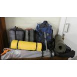 A Collection of Camping Equipment to Include Ground Sheets, Folding Seat, Sleeping Bag, Rucksack etc