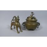 A Persian or North Indian Bronze Koro with Elephant Head Handles, 16cm high Together with a
