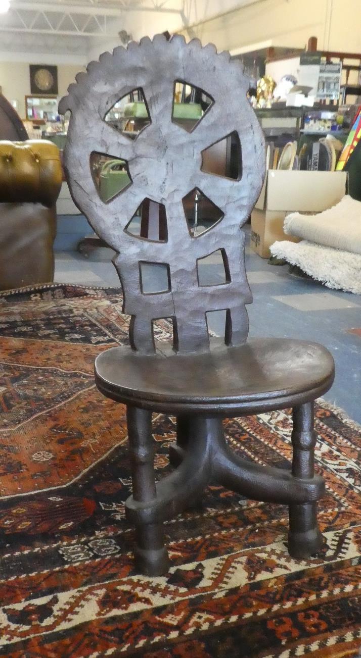 An Ethiopian Carved and Pierced Chair with Wheel Back