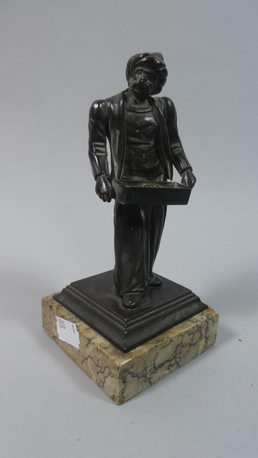 A Late 19th/Early 20th Century Bronze Figural Stand in the Form of Arabic Trader with Box, On Square