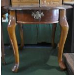 A Modern Mahogany Circular Drum Table on Cabriole Supports