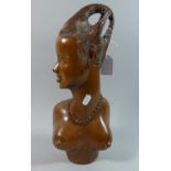 An Ethnic Carved Wooden Bust of a Young Maiden, 38cms High