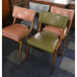 A Harlequin Set of Four 1970s Dining Chairs