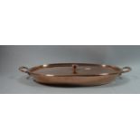 An Edwardian Oval Copper Cooking Pan with Lid and Two Carrying Handles, 49.5cms Wide