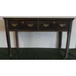 An Oak Two Drawer Side Table with Brass Drop Handles and Oval Escutcheons, 108cms Wide