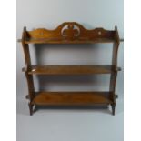 A Wooden Wall Hanging Three Shelf Unit with Fleur De Lys Decoration to Top Rail, 63cms Wide