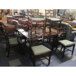 A 19th Century Mahogany Drop leaf Dining Table and Set of Eight Pierced Ladder Back Dining Chairs to