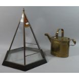 A Hexagonal Terrarium Stand of Architectural Form together with an Army and Navy Brass Watering Can