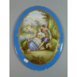 A Late 19th/Early 20th Century Continental Oval Porcelain Plaque Depicting Lovers Resting Under