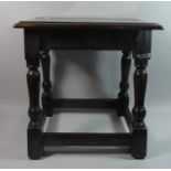 A Stained Oak Rectangular Topped Stool, 45cms Wide