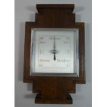 An Art Deco Oak and Chrome Wall Hanging Aneroid Barometer, 31.5cms High